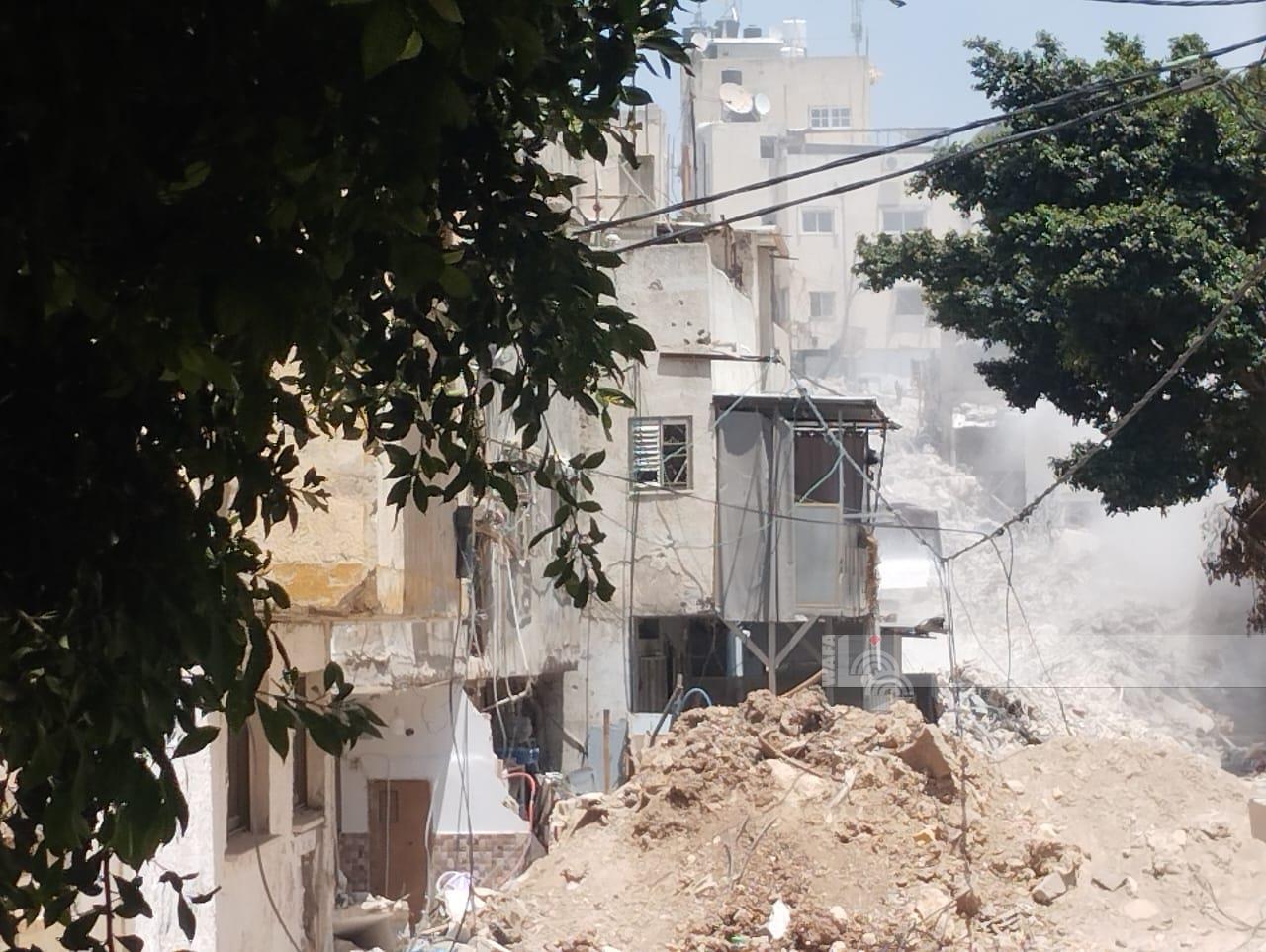 استمرار عمليات هدم المباني والتجريف في مخيم طولكرم